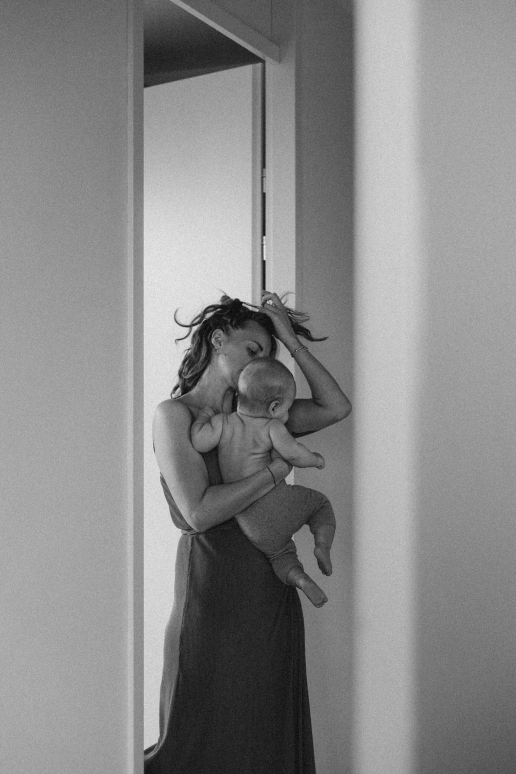 A soft, emotional family moment captured in a cozy home