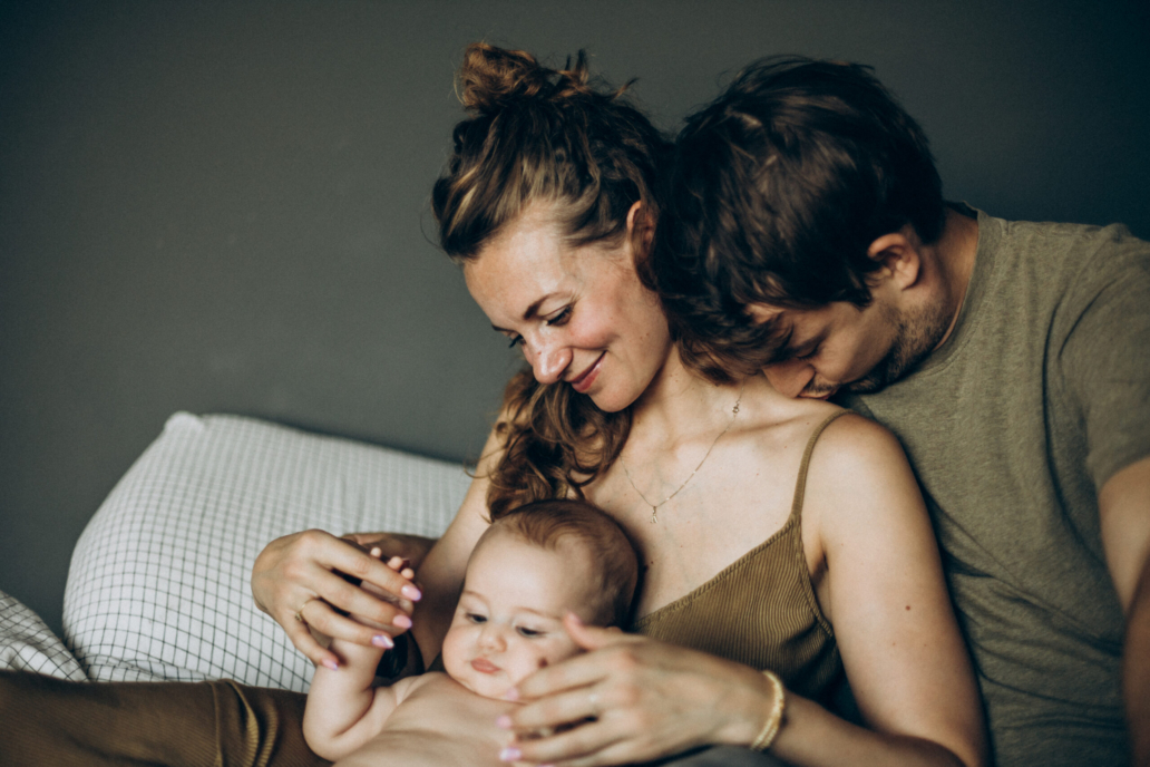 A soft, emotional family moment captured in a cozy home