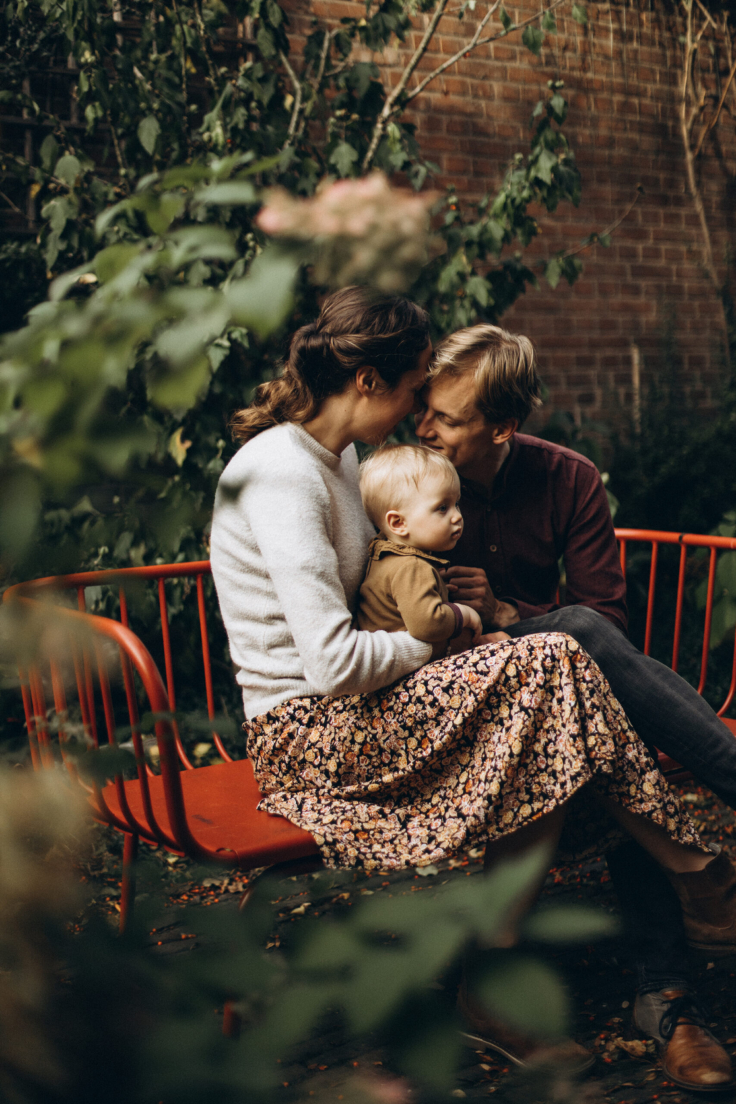 A soft, emotional family moment captured in a cozy home