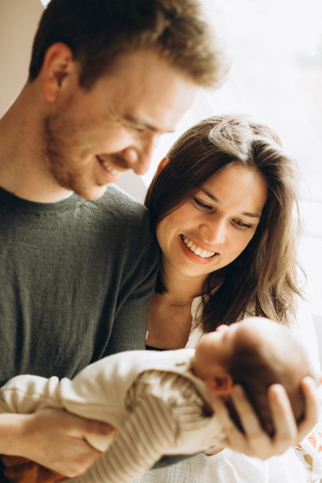 new born baby parents gazing with love at the baby in Ytrecht